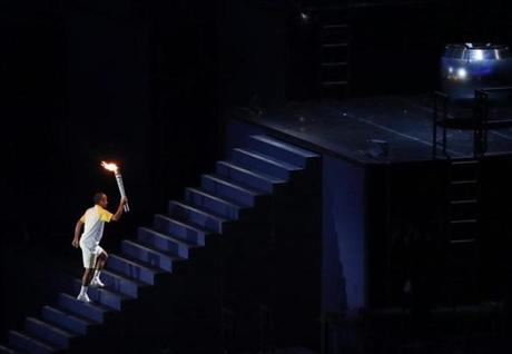 Vanderlei Cordeiro de Lima is about to light the Olympic flame during the Opening Ceremony of the Rio 2016 Olympic Games at the Maracana Stadium.
