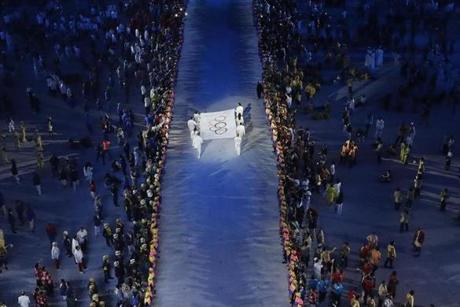 The Olympic flag is carried onto stage during the Opening Ceremony of the Rio 2016 Olympic Game.
