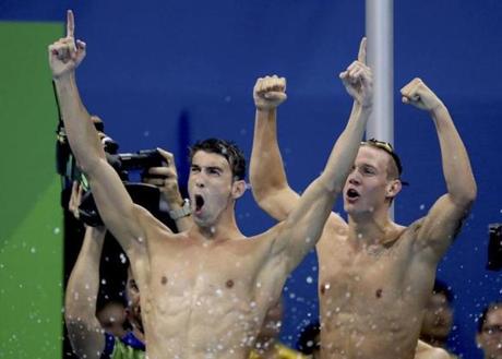 Michael Phelps celebrated after the US team captured the gold in the 4 x 100 relay.  
