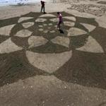Last year, Andrew Amador invited the public to help create an intricate design in the sand.