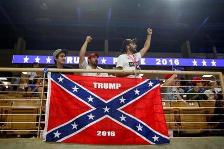 (L-R)Brandon Miles, Brandon Partin and Michael Miles cheer before Republican U.S. presidential nominee Donald Trump attends a campaign rally at the Silver Spurs Arena in Kissimmee, Florida August 11, 2016. REUTERS/Eric Thayer
