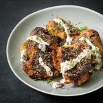 Grilled chicken thighs with honey and za?atar. 