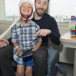 Chris Evans and 7-year-old Jude Langstaff at MassGeneral Hospital for Children.