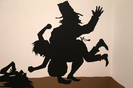 A detail from a cut-paper silhouette wall piece by Kara Walker in ?First Light? at the ICA.
