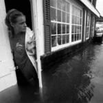 An employee watched as Eel Pond flooded into Shuckers restaurant in the Woods Hole section of Falmouth during Hurricane Bob.