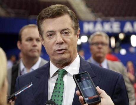 FILE - In this July 17, 2016 file photo, Trump Campaign Chairman Paul Manafort talks to reporters on the floor of the Republican National Convention at Quicken Loans Arena, Sunday, in Cleveland. Emails obtained by The Associated Press shed new light on the activities of a firm run by Donald Trumpâ??s campaign chairman. They show it directly orchestrated a covert Washington lobbying operation on behalf of Ukraineâ??s ruling political party, attempting to sway American public opinion in favor of the countryâ??s pro-Russian government. Manafort and his deputy, Rick Gates, never disclosed their work as foreign agents as required under federal law. (AP Photo/Matt Rourke, File)
