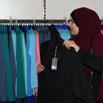 A Muslim customer browses various burkini swimsuits at a shop in western Sydney on August 19, 2016. Part bikini, part all-covering burqa, the burqini swimsuit has sparked huge controversy in France, but in Australia where the beach is a national obsession, it's seen as a symbol of inclusion, says its designer Aheda Zanetti. The light-weight, quick-drying two-piece swimsuit which covers the body and hair has been banned from French beaches by several mayors in recent weeks following deadly attacks linked to Islamic jihadists. / AFP PHOTO / SAEED KHANSAEED KHAN/AFP/Getty Images