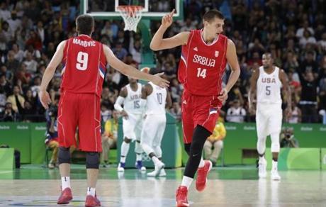 Serbia's Nikola Jokic (14) celebrates a score during a men's basketball game against the United States at the 2016 Summer Olympics in Rio de Janeiro, Brazil, Friday, Aug. 12, 2016. (AP Photo/Eric Gay)
