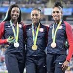 Gold medallist USA's Brianna Rollins (C) poses with silver medallist USA's Nia Ali (L) and bronze medallist USA's Kristi Castlin on the podium of the Women's 100m Hurdles during the athletics event at the Rio 2016 Olympic Games at the Olympic Stadium in Rio de Janeiro on August 18, 2016. / AFP PHOTO / Damien MEYERDAMIEN MEYER/AFP/Getty Images