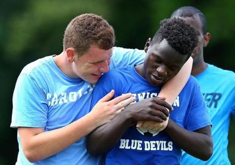 Dalton Wing (left), 17, clowned around with co-captain Joseph Kalilwa, 17, from Congo. 
