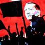 TOPSHOT - Supporters stands in front of a screen displaying a portrait of Turkish President Recep Tayyip Erdogan during a rally at Kizilay Square in Ankara on July 20, 2016, Erdogan on Wednesday declared a three-month state of emergency, vowing to hunt down the 