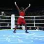 Claressa Shields performed a cartwheel in the ring, then took a victory lap with the American flag on her back.
