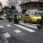 epa05470917 Brazilian police on motorbikes patrol the streets of Copacabana in Rio de Janeiro, Brazil, 10 August 2016. An official Rio 2016 Olympic Games bus carrying media came under fire on 09 August 2016 according to reports. EPA/BARBARA WALTON