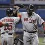 Boston Red Sox's David Ortiz, right, celebrates with Dustin Pedroia after Ortiz hit a two-run home run off Tampa Bay Rays starting pitcher Matt Andriese during the first inning of a baseball game Wednesday, Aug. 24, 2016, in St. Petersburg, Fla. (AP Photo/Chris O'Meara)
