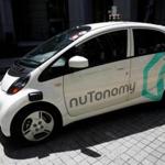 A nuTonomy self-driving taxi made its way down the road in its public trial in Singapore. 