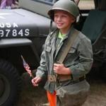 Joseph Clayton got to wear some vintage World War II items while visiting Fort Devens Museum's open house event. 