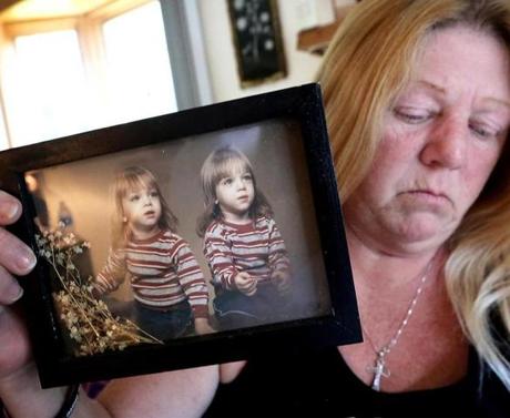 Sherri Smith held an early photo of her twin sons, Jesse and Tony Sparks, both of whom died from accidental drug overdoses. 
