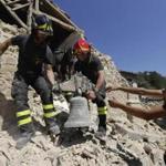 Firefighters retrieved a bell Sunday from a church in the small town of Rio, near Amatrice, in central Italy. 