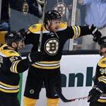 10/27/15: Boston, MA: The TD Garden faithful fans have not had much to cheer about so far this season as the Brins have yet to win on home ice, but after Jimmy Hayes(11) scored in the second period to put Boston ahead 2-0, they may just have a chance for their first home victory of the season. Hayes (center) celebrates with teammates Ryan Spooner (left) and Matt Beleskey (right). The Boston Bruins hosted the Arizona Coyotes in a regular season NHL hockey game at the TD Garden. (Globe Staff Photo/Jim Davis) section:sports topic:Bruins-Coyotes (1)