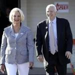 US Senator John McCain and his wife, Cindy, left a polling station after voting on Tuesday. 