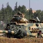A Turkish army tank was stationed near the Syrian border, in Suruc, Turkey, on Saturday, 