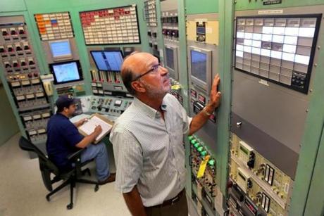 David Moncton, the head of MIT?s Nuclear Research Laboratory, examined a display at the laboratory.
