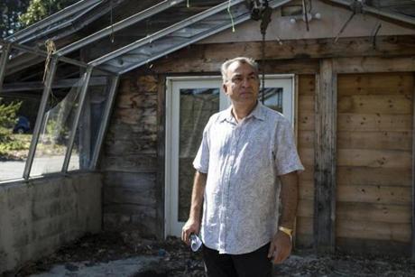 Ebrahim Masalehdan walked around his Westford property that he wants to turn into a restaurant.
