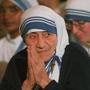 Mother Teresa of Calcutta stands with Cardinal Bernard Law outside Our Lady of Christians in Newton MA. 