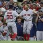 Chris Young was greeted by Mookie Betts as he returns to the dugout after hitting a solo home run in the fourth inning.