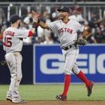 Boston Red Sox's Chris Young, right, high-fives Dustin Pedroia after the Red Sox defeated the San Diego Padres 5-1 in a baseball game Tuesday, Sept. 6, 2016, in San Diego. Young homered in the game. (AP Photo/Lenny Ignelzi)