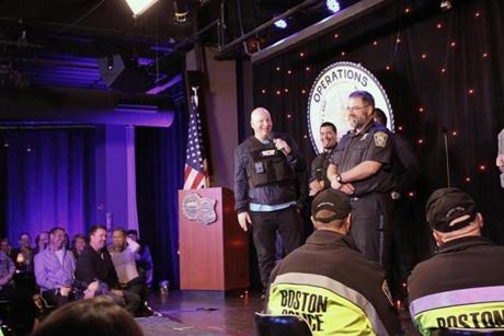 Comedian Jeff Ross (holding the microphone) during his recent roast of the Boston police force.
