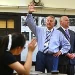 Boston, MA--9/8/2016--On the first day of school, Boston Latin School headmaster Michael Contompasis (cq), left, and assistant headmaster Jonathan Mulhern (cq) introduce themselves to 