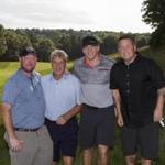 From left: Synergy Investments president David Greaney, Bobby Orr, Shawn Thornton, and Ken Casey of the Dropkick Murphys at the Claddagh Fund golf tournament. 