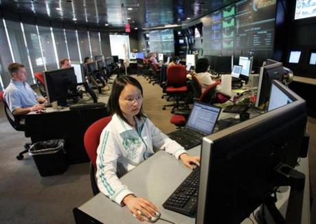 In this 2006 file photo, Eva Chan studied her screen at Akamai Technologies Inc. in Cambridge.
