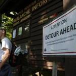 Ben Wildes, 23, of Waterboro, Maine stood beside a sign posted for a detour due to ongoing construction on the Tuckerman Ravine Trail at Pinkham Notch.  