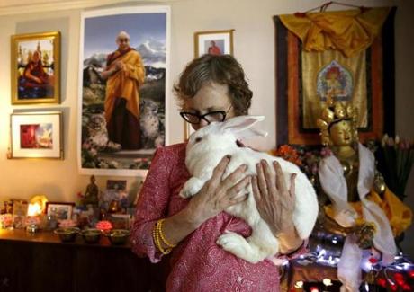 Wendy Cook with Kunsang, also known as Papa Bear, one of the rabbits she bought.
