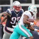 Chris Long, closing in on Miami?s Kenyan Drake, had a number of big plays in the win over the Dolphins.