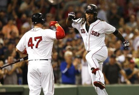 Boston, MA - 9/18/2016 - Boston Red Sox Hanley Ramirez (L) celebrates his solo home run against the Yankees with Red Sox teammate Travis Shaw during the seventh inning at Fenway Park in Boston, MA, September 18, 2016. (Jessica Rinaldi/Globe Staff) Topic: RedSox-Yankees 
