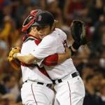 Boston, MA - 9/18/2016 - Boston Red Sox closer Koji Uehara (R) hugs catcher Bryan Holaday after the last out against the Yankees to end the ninth inning at Fenway Park in Boston, MA, September 18, 2016. (Jessica Rinaldi/Globe Staff) Topic: RedSox-Yankees 