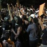 Protesters demonstrated a line of police officers Tuesday in Charlotte, N.C.