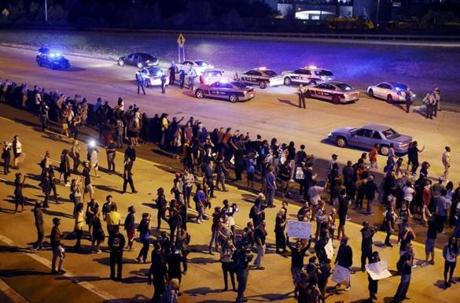 Protesters headed onto the highway during another night of protests over the police shooting of Keith Scott in Charlotte, North Carolina on Thursday. 
