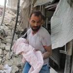 A Syrian man carried the body of an infant retrieved from under the rubble of a building following a reported airstrike on Friday in the northern city of Aleppo. Missiles rained down on rebel-held areas of Aleppo, causing widespread destruction that overwhelmed rescue teams, as the army prepared a ground offensive to retake the city