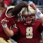 Boston College Eagles quarterback Patrick Towles, (8) and Boston College Eagles running back Jon Hilliman (32) celebrated after Towles ran the ball 17 yards for a touchdown in the first quarter. 