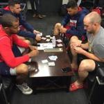 Red Sox players (front, from left) Chris Young and Travis Shaw play cribbage before a recent game at Fenway Park, while teammates (back, from left) Deven Marrero and Marco Hernandez play cards.