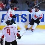 Sep 29, 2016; Toronto, Ontario, Canada; Team Canada center Brad Marchand (63) celebrates with teammates Alex Pietrangelo (27)a nd Jay Bouwmeester (4) after scoring a short-handed goal against Team Europe during the third period in game two of the World Cup of Hockey final at Air Canada Centre. Mandatory Credit: Jerry Lai-USA TODAY Sports