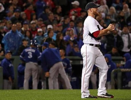 Boston, MA - 10/01/2016 - (9th inning) Boston Red Sox relief pitcher Craig Kimbrel (46) looks away from the Toronto Blue Jays dugout celebration after Toronto took the 4-3 lead on a sacrifice fly in the ninth inning. The Boston Red Sox take on the Toronto Blue Jays in Game 2 of a 3 game series at Fenway Park. - (Barry Chin/Globe Staff), Section: Sports, Reporter: Peter Abraham, Topic: 02Sox-Jays, LOID:8.3.170500066.

