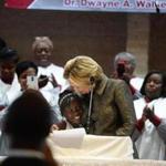 Democratic presidential candidate Hillary Clinton hugged Zianna Oliphant after inviting her to the stage as she finished speaking at Little Rock A.M.E. Zion Church in Charlotte, N.C., Sunday.