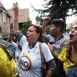 Opponents to the peace deal signed by the Colombian government and rebels celebrated Sunday in Bogota as they listened to the results of a referendum on the accord.