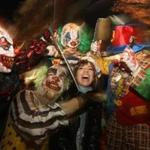 Vanessa Beer of Boston posed with a group of costumed clowns on Halloween night in Salem in 2008. 