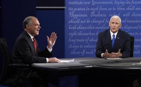 Tim Kaine (left) and Mike Pence often interrupted each other to deliver zingers targeted at the top of the ticket.
